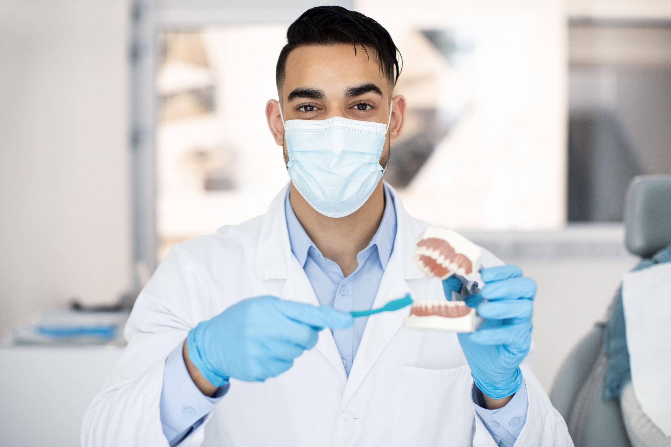 Doctor showing a dental prosthesis