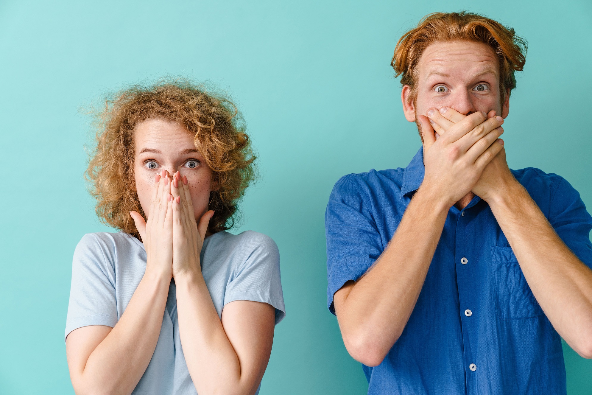 Two individuals covering their mouth (and bad breath)